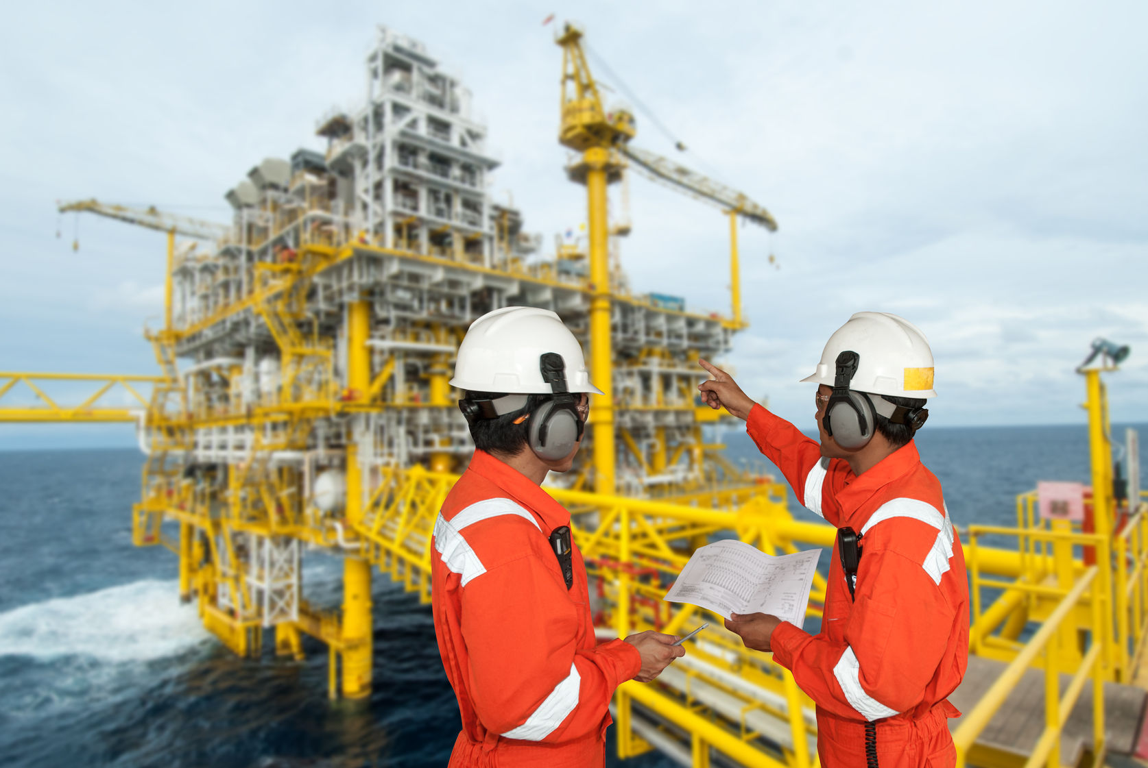 41250295 - oil worker and oil rig